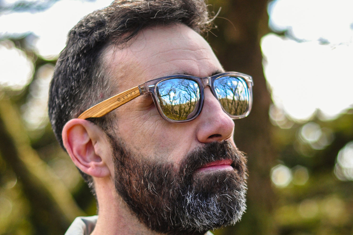 Man looking out to a landscape wearing Luma Wistman sunglasses