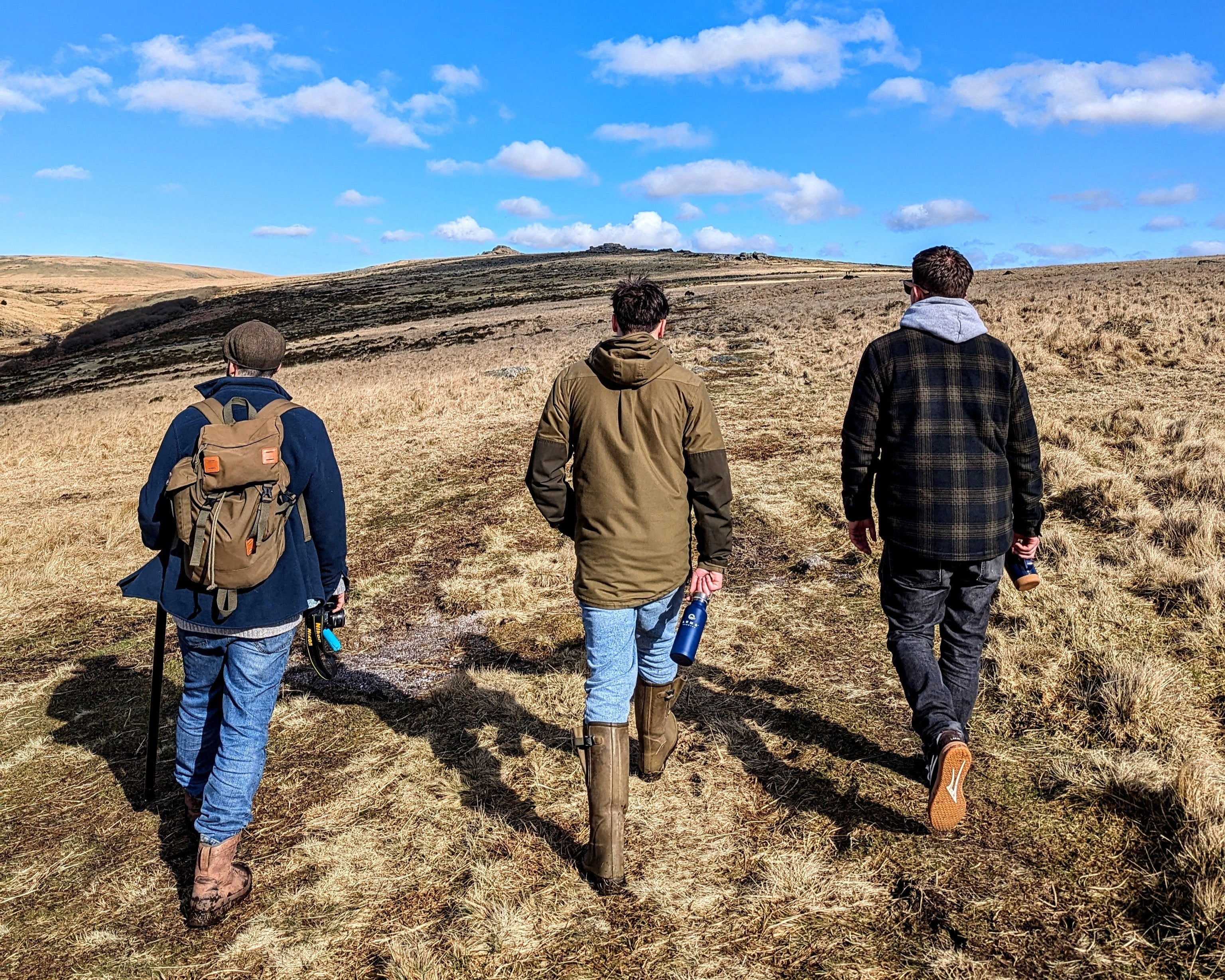 three men hiking on dartmoor