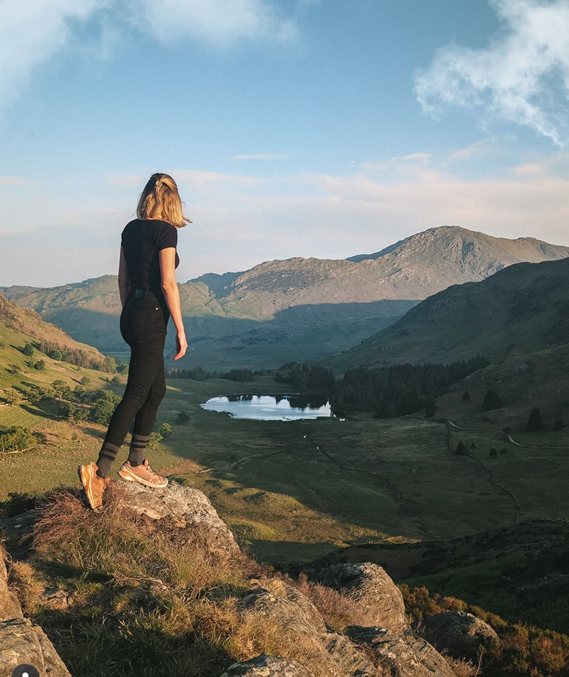 Woman climbing Lake district mountains