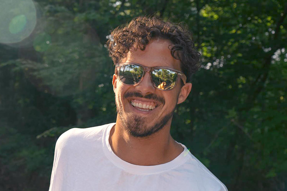 Man wearing sunglasses and smiling