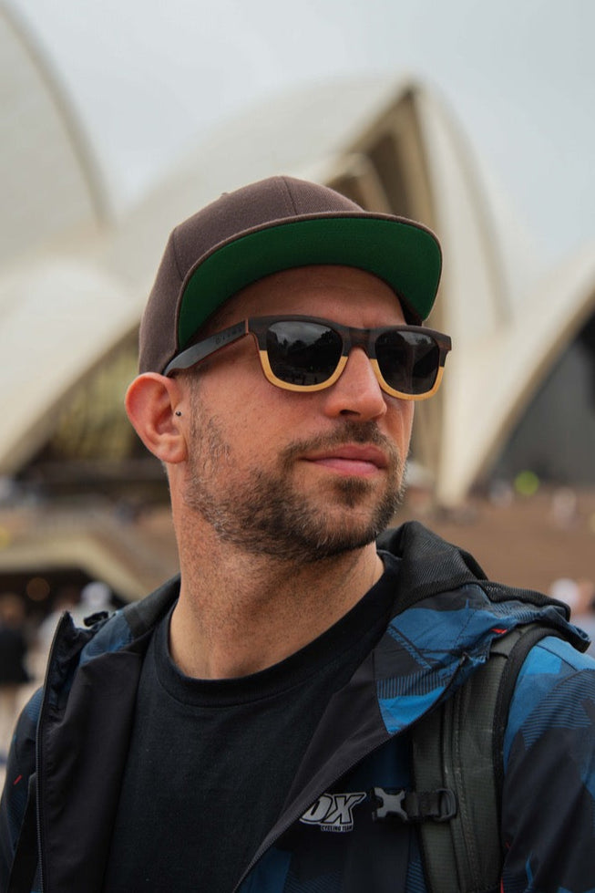 Man wearing wooden eco-friendly sunglasses