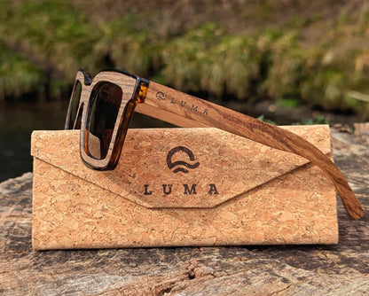 Luma Polzeath sunglasses in wood on tree stump with case